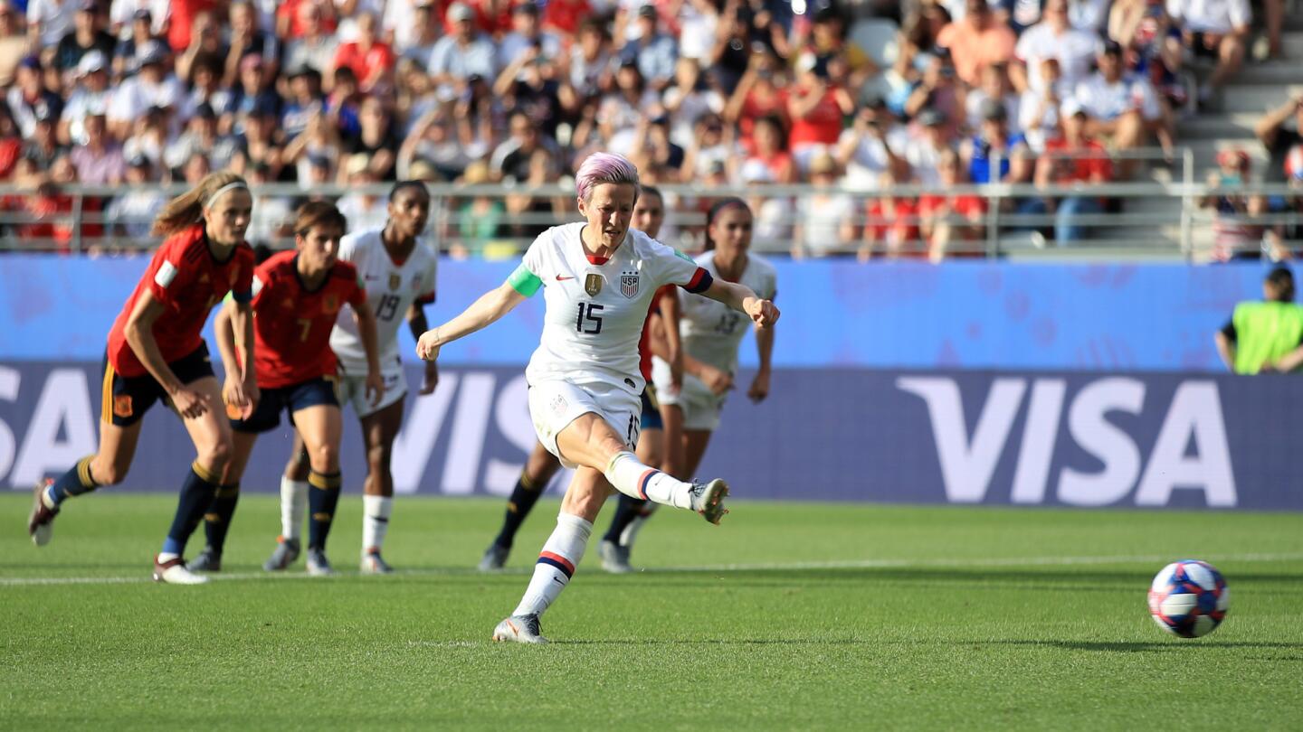 Megan Rapinoe of the U.S. scores her team's second goal against Spain from the penalty spot.