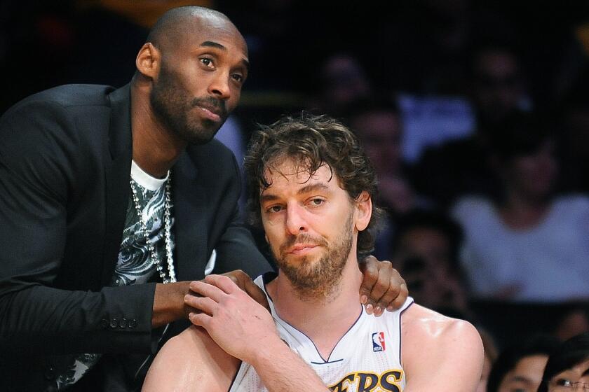 Lakers' Kobe Bryant consoles Pau Gasol late in the fourth quarter of Game 4 against the San Antonio Spurs.