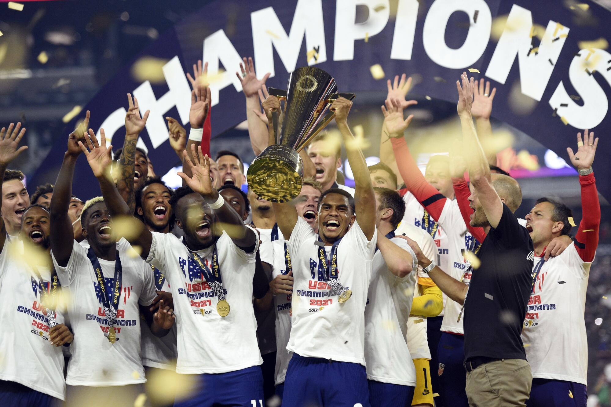 United States celebrate their extra-time victory over Mexico in the CONCACAF.