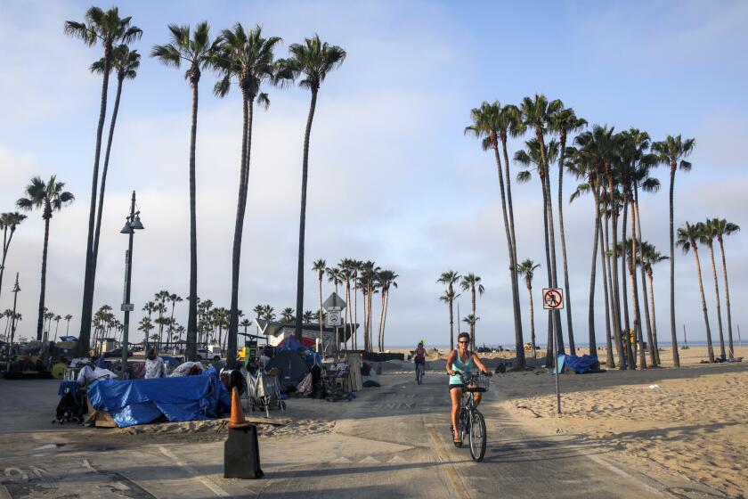 Venice, CA - July 09: Los Angeles City conducts a major cleanup of homeless encampments on the boardwalk on Friday, July 9, 2021 in Venice, CA. (Irfan Khan / Los Angeles Times)