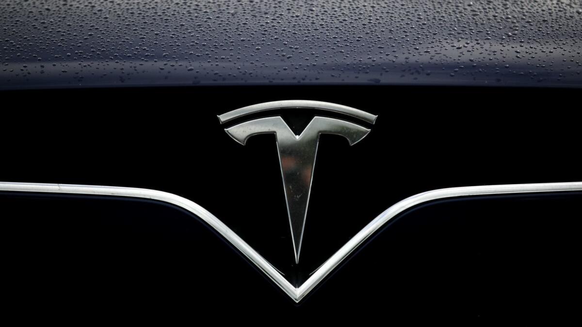 The Tesla logo.