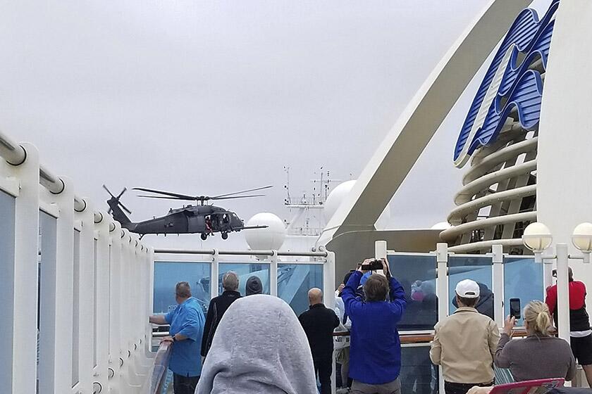 A National Guard helicopter hovers over the Grand Princess cruise ship off the coast of California on Thursday.