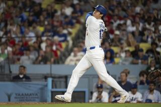Los Angeles Dodgers' Shohei Ohtani (17) watches his solo home run during the eighth inning of a baseball game against the Philadelphia Phillies in Los Angeles, Monday, Aug. 5, 2024. (AP Photo/Kyusung Gong)