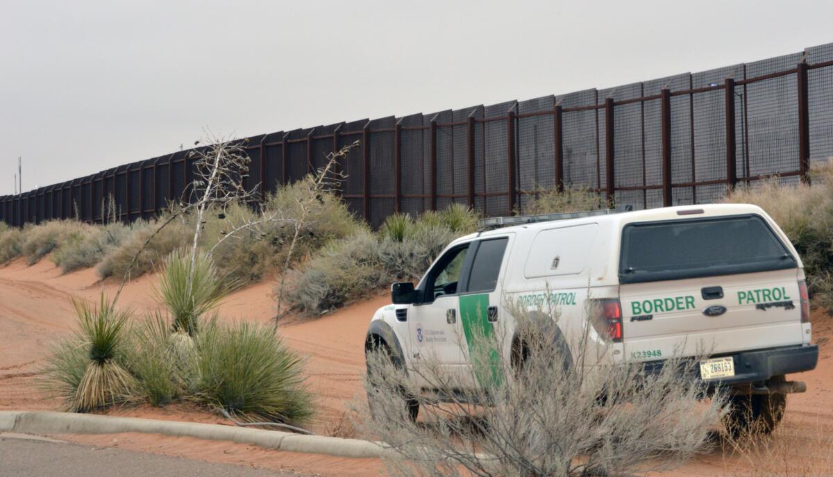 A U.S. Border Patrol vehicle drives along a U.S.-Mexico border fence in the booming New Mexico town of Santa Teresa in an undated photo.