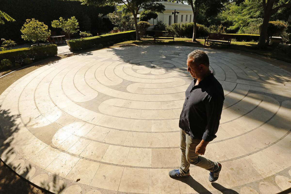 A  man walks a labyrinth at the Pace Awareness Labyrinth & Gardens in West Adams.