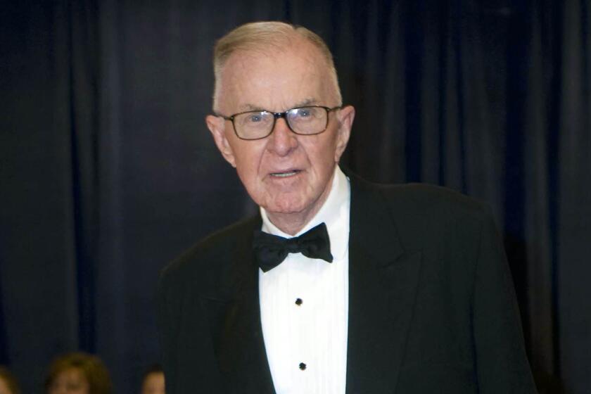 John McLaughlin, host of "The McLaughlin Group," arrives at the White House Correspondents' Association dinner in Washington in 2012.