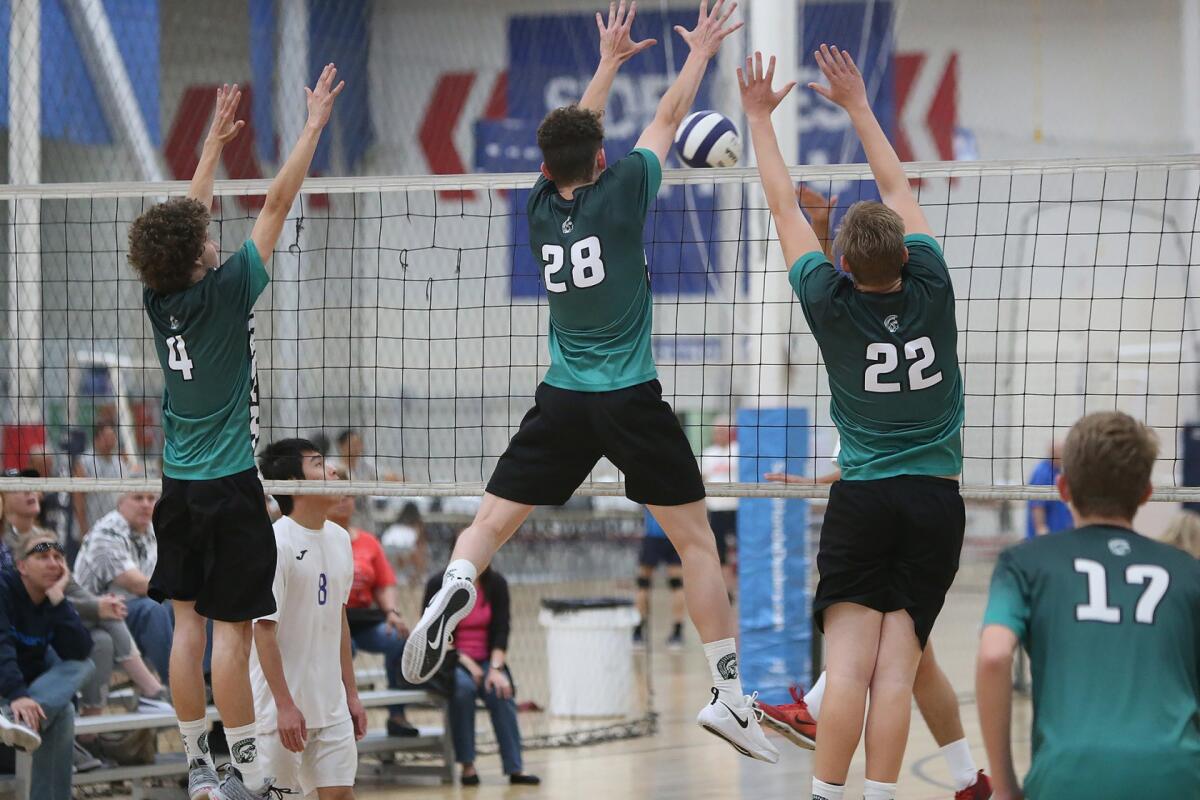 Brethren Christian High puts up a block at American Sports Centers on April 16, 2019.