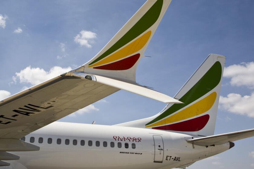 The winglet of an Ethiopian Airlines Boeing 737 Max 8 is seen as it sits grounded at Bole International Airport in Addis Ababa, Ethiopia Saturday, March 23, 2019. The chief of Ethiopian Airlines says the warning and training requirements set for the now-grounded 737 Max aircraft may not have been enough following the Ethiopian Airlines plane crash that killed 157 people. (AP Photo/Mulugeta Ayene)