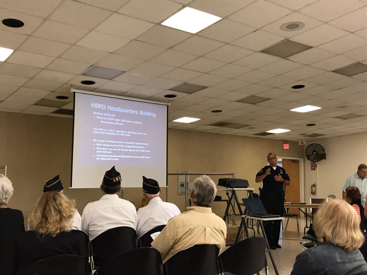 Huntington Beach Police Chief Robert Handy tells residents about the deterioration of his department's headquarters during a community meeting Thursday at the Rodgers Seniors' Center.