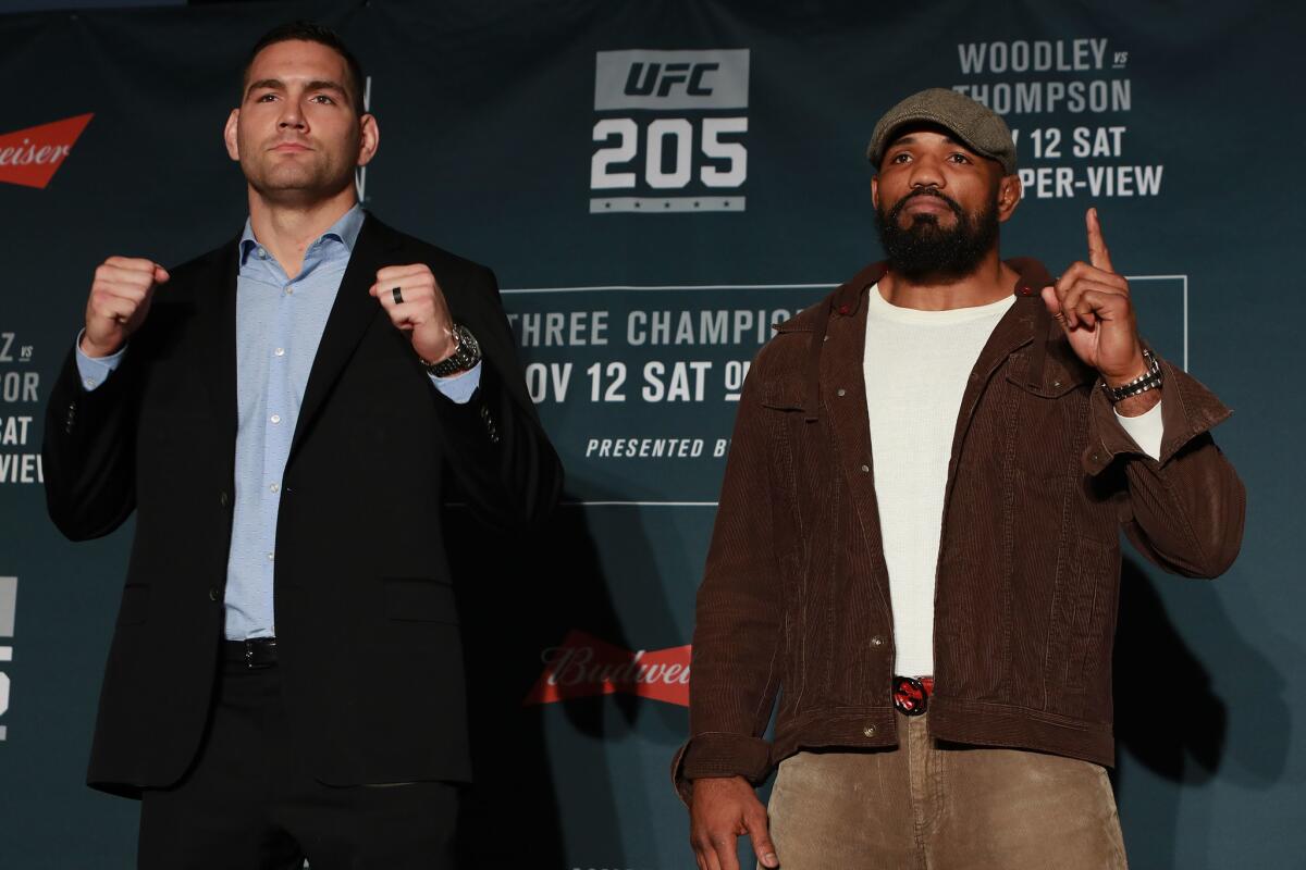 Chris Weidman, left, and Yoel Romero take part in the UFC 205 Ultimate Media Day on Wednesday at Madison Square Garden.
