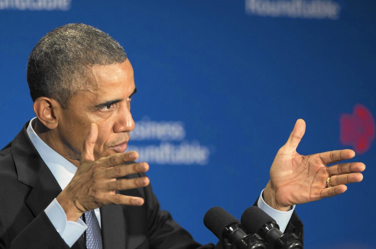 President Obama addresses a meeting of the Business Roundtable in Washington. Obama told executives that he'd like to include discussions about longer-term extensions of some tax breaks, particularly the research and development credit, as part of a comprehensive corporate tax overhaul.