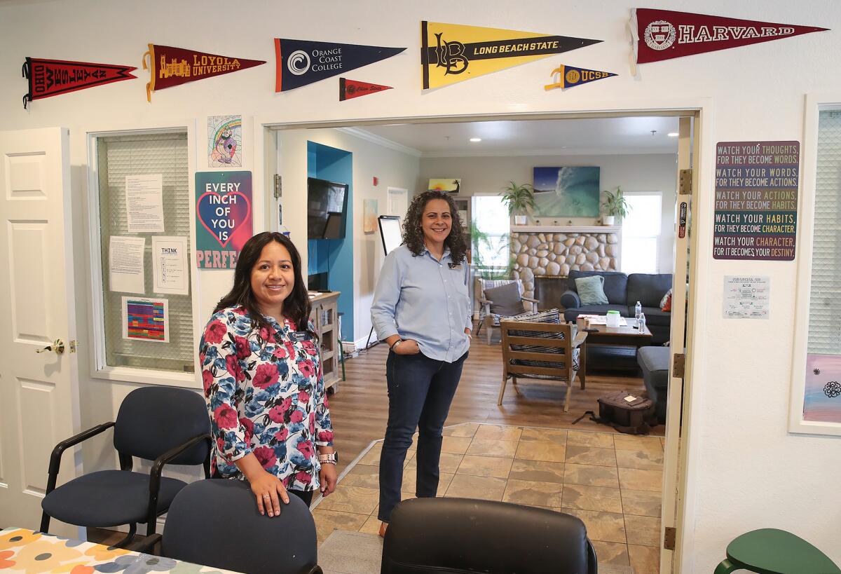 Co-directors Nancy Galeana and Isabel Kluwe, from left, stand in the game and living room in the Waymakers Youth Shelter.