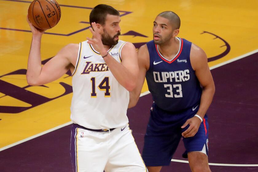 LOS ANGELES,, CALIF. - DEC. 13, 2020. Lakers center Marc Gasol posts up against Clippers forward Malik Fitts during a presaason game at Staples Center on Sunday night, Dec. 13, 2020. (Luis Sinco/Los Angeles Times)