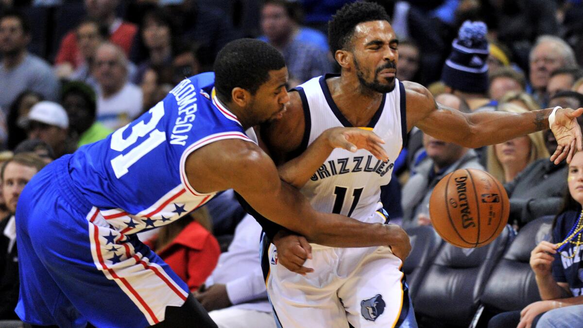 Grizzlies guard Mike Conley has the ball knocked away by 76ers guard Hollis Thompson in the first half Sunday.