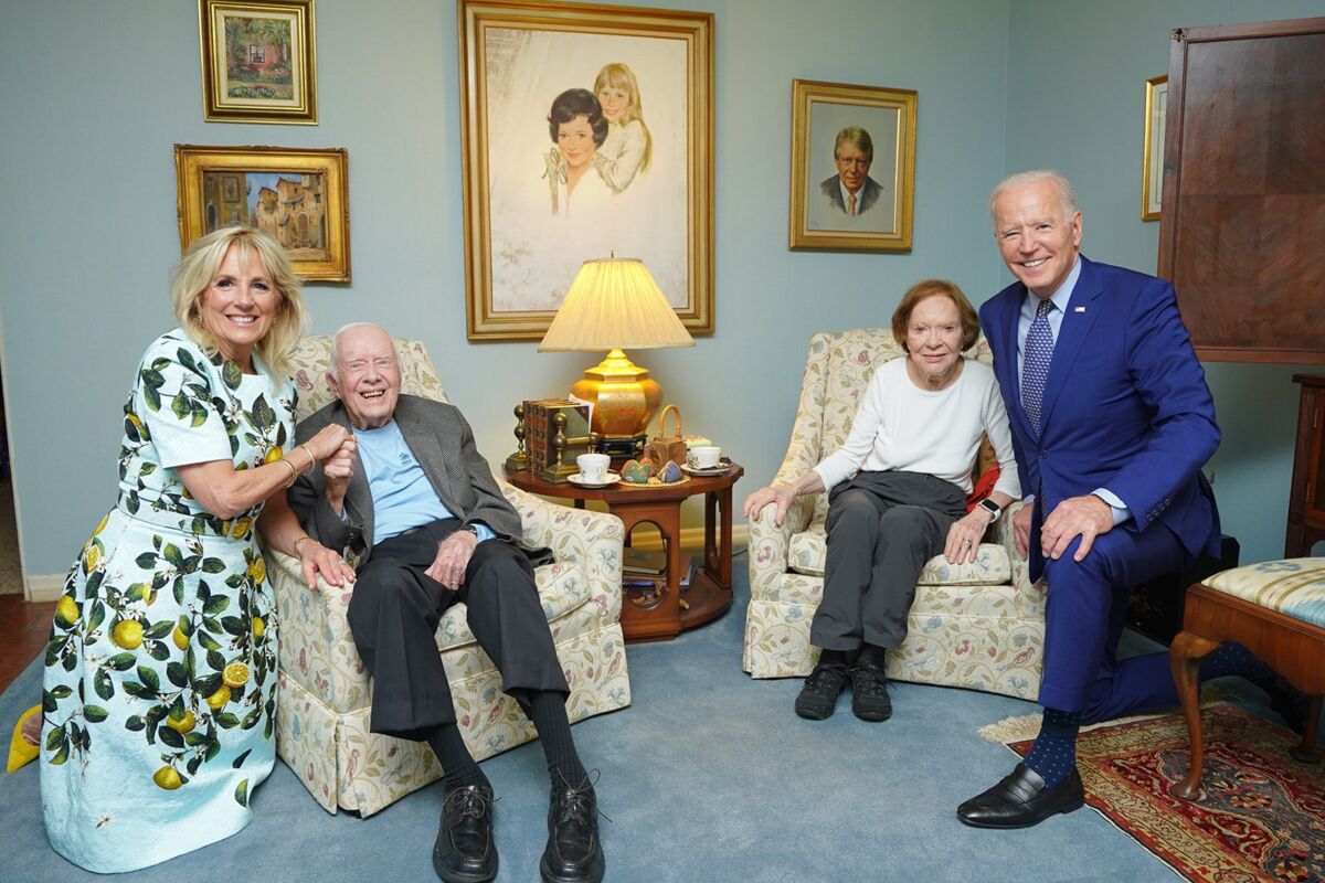 In this April 30, 2021, photo released by The White House, former President Jimmy Carter and former first lady Rosalynn Carter pose for a photo with President Joe Biden and first lady Jill Biden at the home of the Carter's in Plains Ga. (Adam Schultz, The White House via AP)