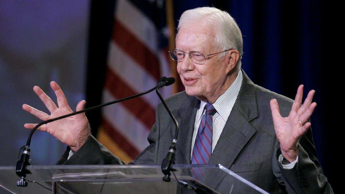 Former President Jimmy Carter gestures as he speaks about his Christian faith during a meeting of the New Baptist Covenant's Midwest Region in Norman, Okla., Friday, Aug. 7, 2009.(AP Photo/Sue Ogrocki)
