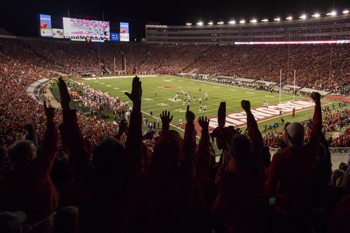 Wisconsin football fans cheer after a Badgers touchdown.