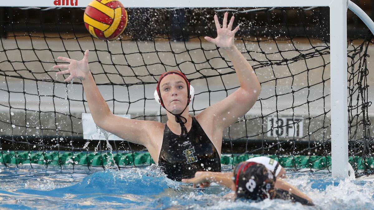Edison High School water polo goalkeeper Coryn Cavechee defends the net during the first round of the CIF Southern Section Division 4 playoffs at Troy High School on Feb. 5. A planned new pool at Edison is scheduled to be completed in October 2020.