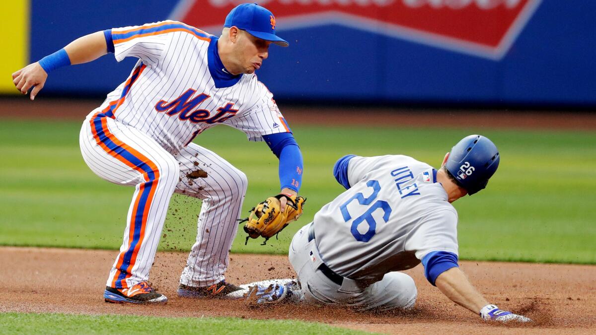 The Dodgers' Chase Utley is tagged out by Mets shortstop Asdrubal Cabrera on a steal attempt in the first inning Friday.