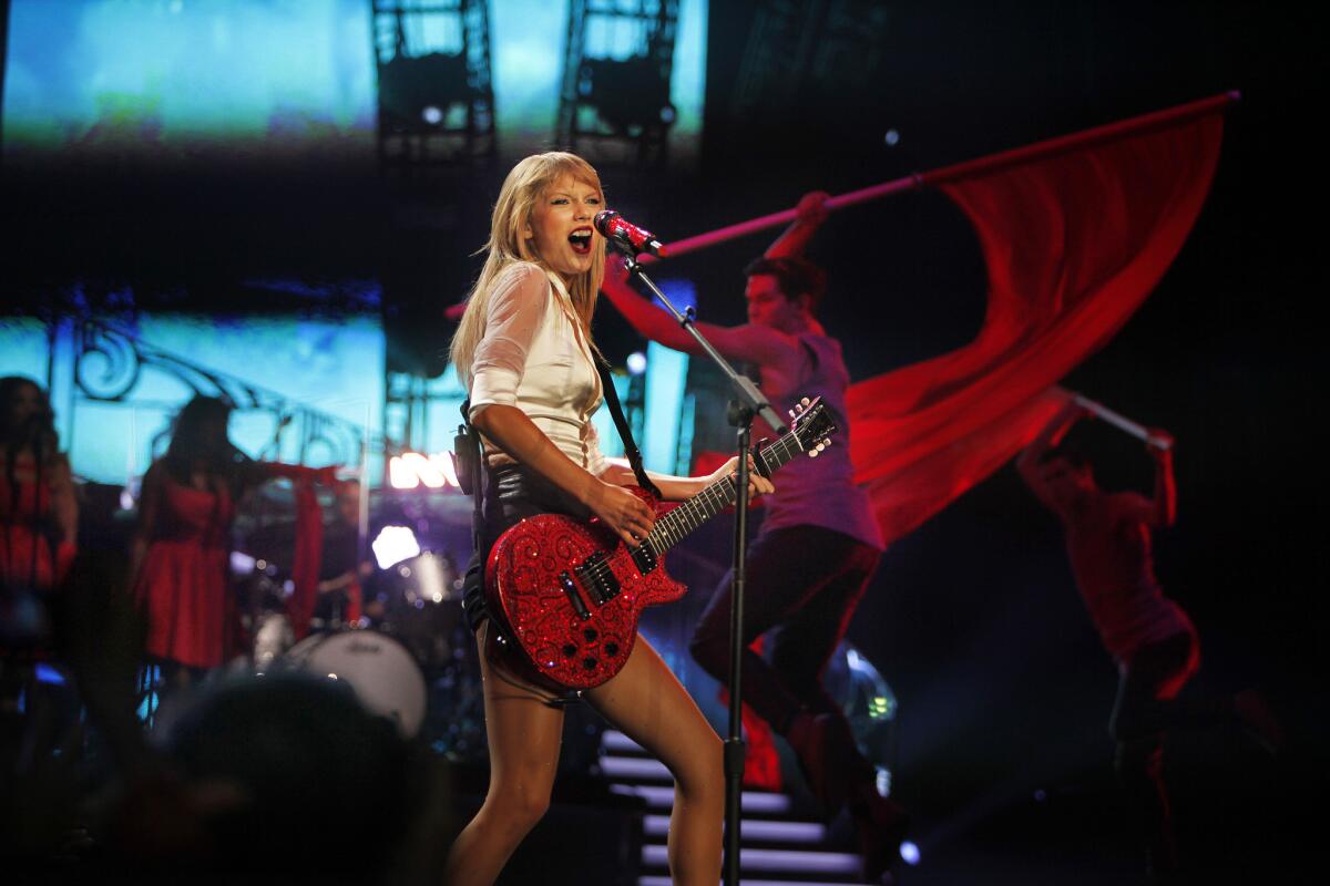 Taylor Swift, seen performing at Staples Center, is among the nominees for the Golden Globe for original song with her tune "Sweeter Than Fiction."