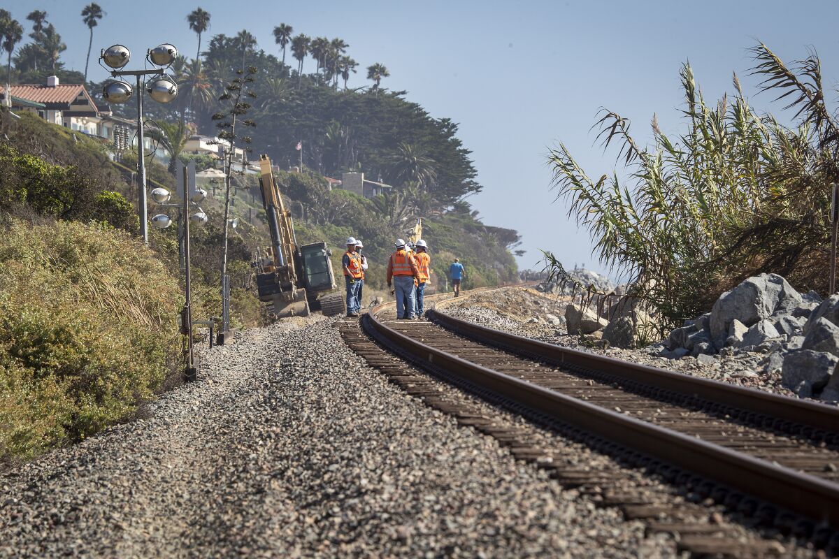 Work continues on a closed portion of tracks between Orange and San Diego counties in San Clemente.