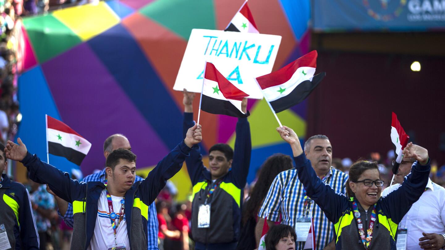 The Syrian Special Olympics team walks out for the Special Olympics World Games Closing Ceremony at the Los Angles Memorial Coliseum on Sunday.