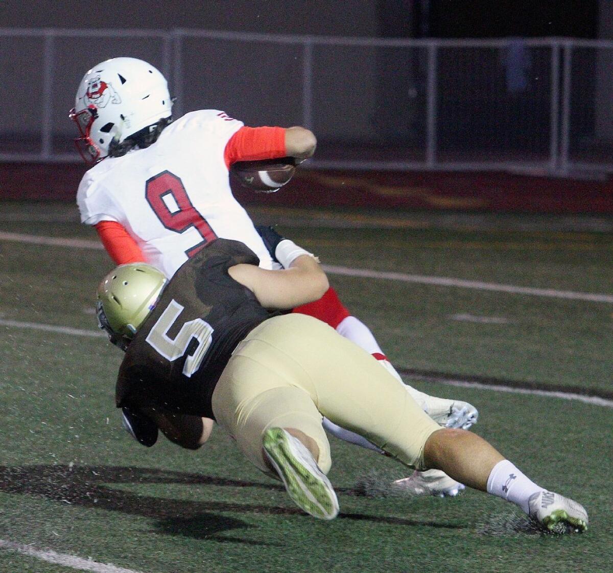 St. Francis High's Gabriel Grbavac notches one of his three sacks in the Golden Knights' 35-0 win over Pasadena on Friday night.