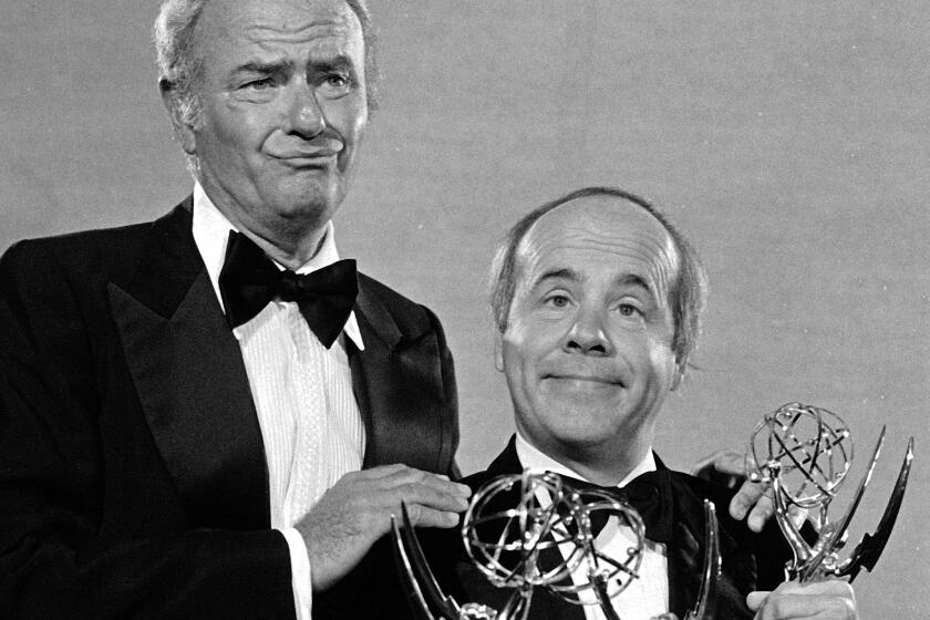 Sept. 18, 1978 photo, comedians Harvey Korman, left, and Tim Conway show off three Emmy Awards for the "Carol Burnett Show"