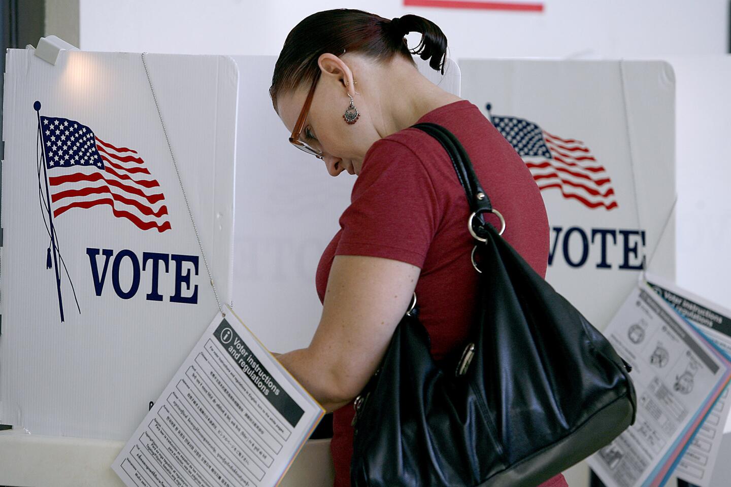 Merrideth Lesyshyn, 43 of Glendale, votes at Wilson Middle School in Glendale on Tuesday, Nov. 6, 2012. Today is general election day throughout the nation.