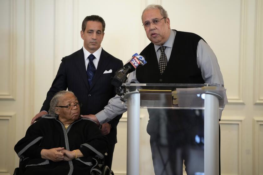 Sam Lemon, right, speaks during a news conference with Susie Williams Carter, center, and lawyer Michael Pomerantz, Monday, May 20, 2024, in Philadelphia. Carter is the sister of the youngest person ever executed in the state of Pennsylvania, Alexander McClay Williams, 16, and Lemon is the great-grandson of the attorney who represented him. Carter is suing the county where the Black teenager was convicted in 1931. The suit comes two years after Williams' conviction by an all-white jury was vacated. (AP Photo/Matt Slocum)