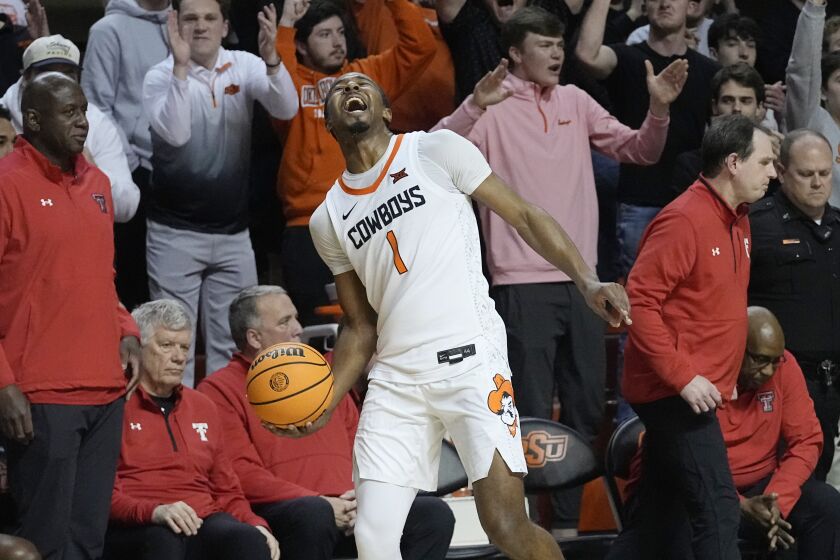 Oklahoma State guard Bryce Thompson (1) celebrates at the end of the game as Oklahoma State defeats Texas Tech in an NCAA college basketball game Wednesday, Feb. 8, 2023, in Stillwater, Okla. (AP Photo/Sue Ogrocki)