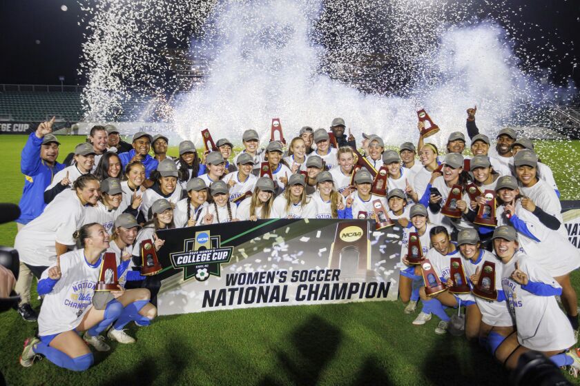 UCLA celebrates after defeating North Carolina to win the NCAA college women's soccer tournament final.