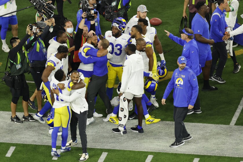Rams defensive lineman Aaron Donald and coach Sean McVay hug after winning Super Bowl LVI.