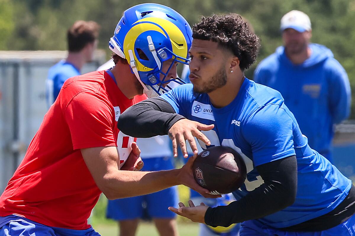 Rams running back Blake Corum takes a handoff from Matthew Stafford.