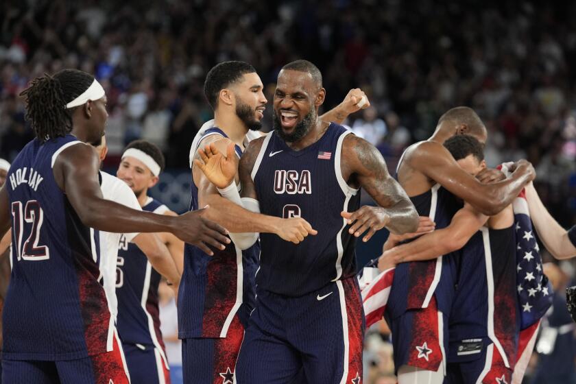 United States' LeBron James (6) celebrates after beating France to win the gold medal during a men's gold medal basketball game at Bercy Arena at the 2024 Summer Olympics, Saturday, Aug. 10, 2024, in Paris, France. (AP Photo/Rebecca Blackwell)