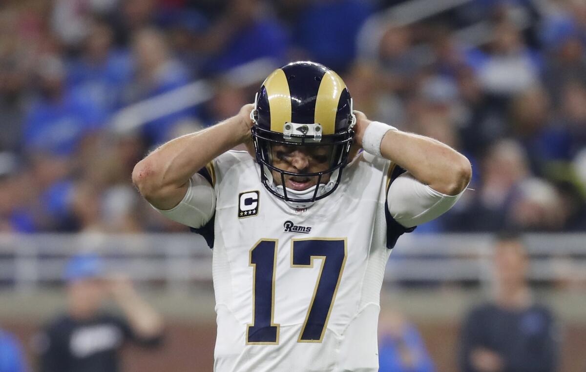 Rams quarterback Case Keenum adjusts his helmet during the second half of a loss to the Lions, 31-28.