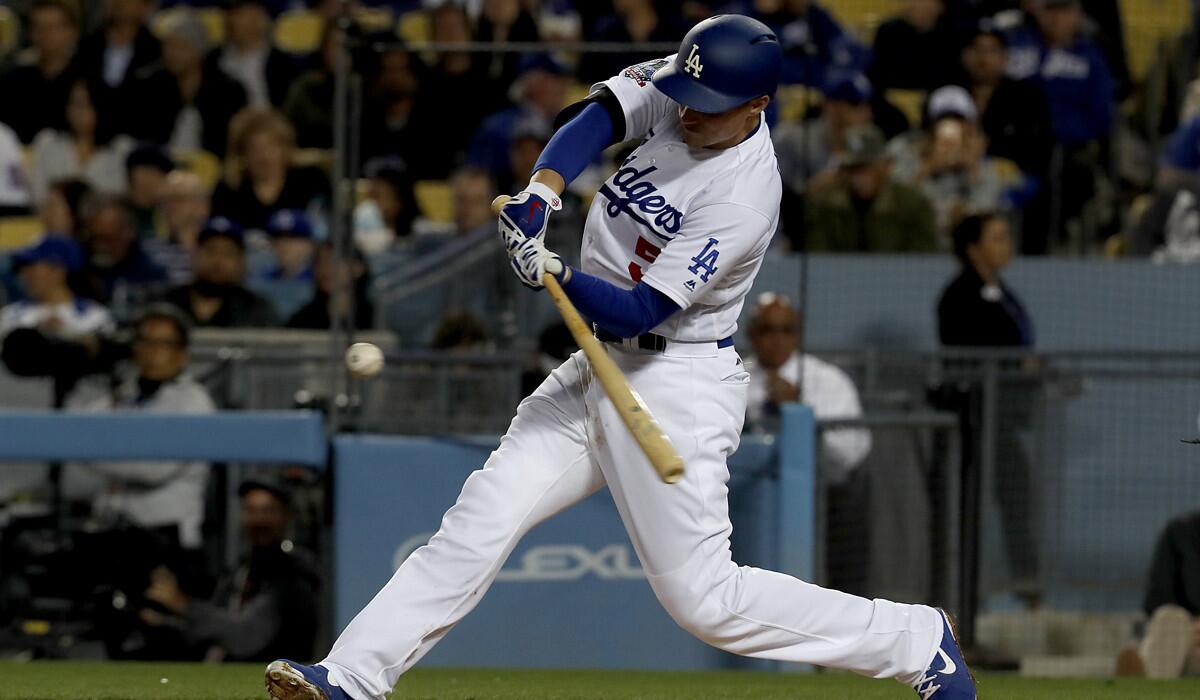 Dodgers shortstop Corey Seager connects for a double against the Miami Marlins in the third inning on April 24 at Dodger Stadium.