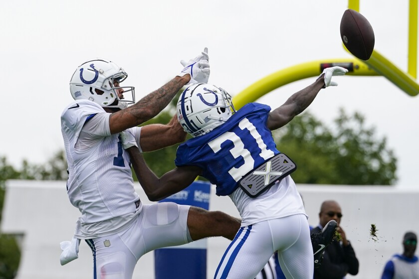 Indianapolis Colts safety Julian Blackmon (32) breaks up a pass to wide receiver Michael Pittman Jr. (11)during practice at the NFL team's football training camp in Westfield, Ind., Tuesday, Aug. 2, 2022. (AP Photo/Michael Conroy)