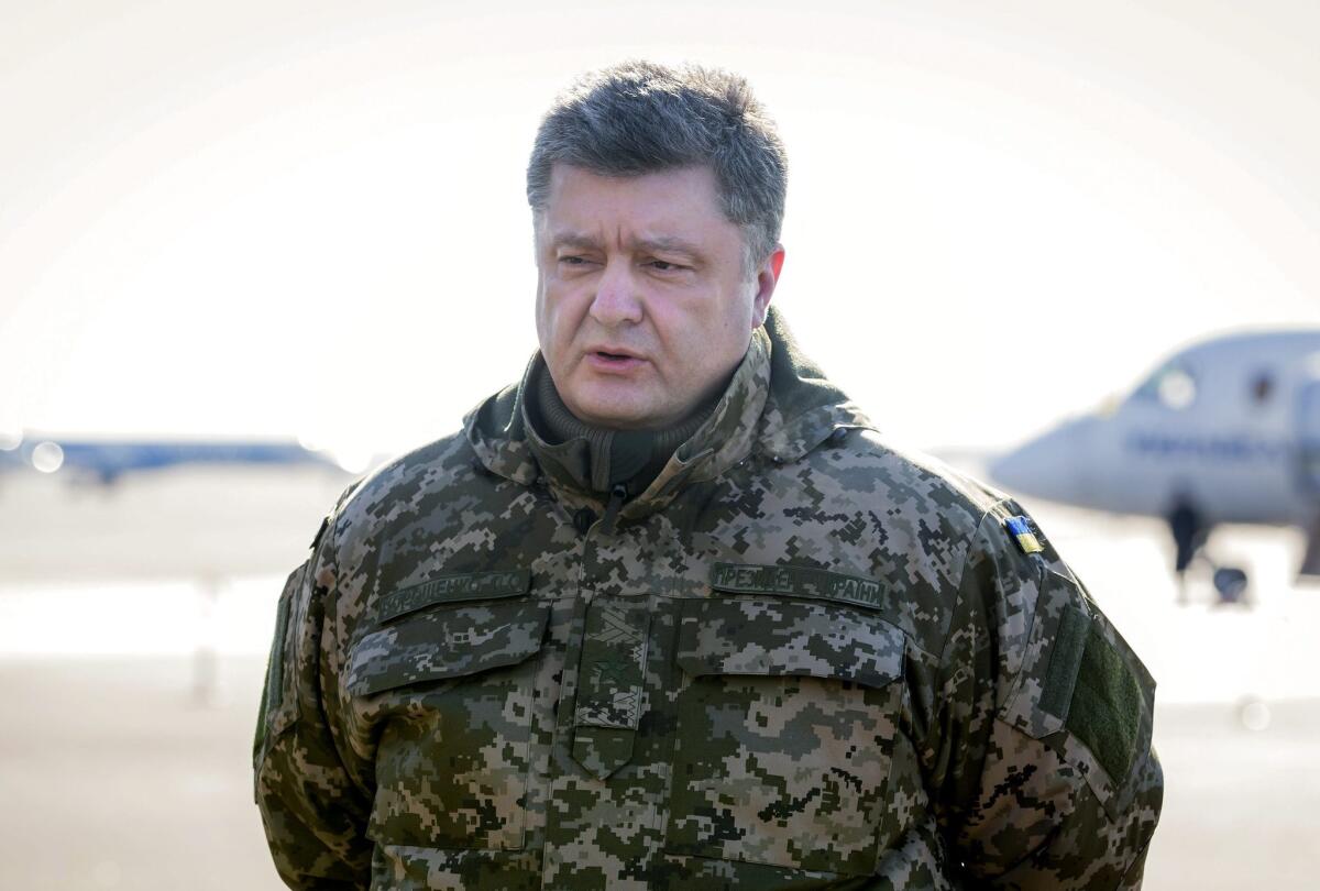 Ukrainian President Petro Poroshenko announces that government forces are pulling out of Debaltseve in a statement at an airport in Kiev, Ukraine, on Feb. 18.
