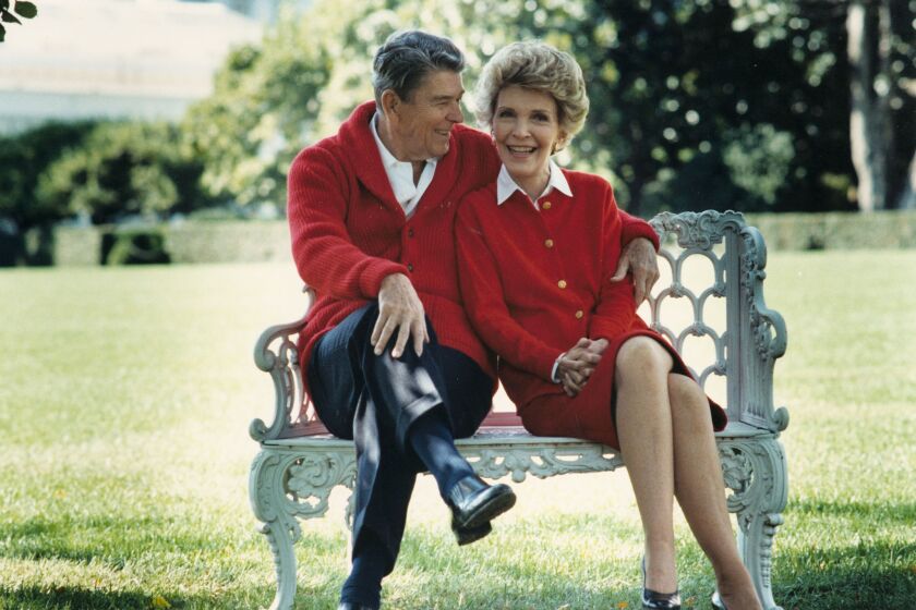 Former President Ronald Reagan and First Lady Nancy Reagan share a moment on their 50th anniversary on March 4, 2002. Nancy turned to astrology in the White House in an attempt to protect her husband.