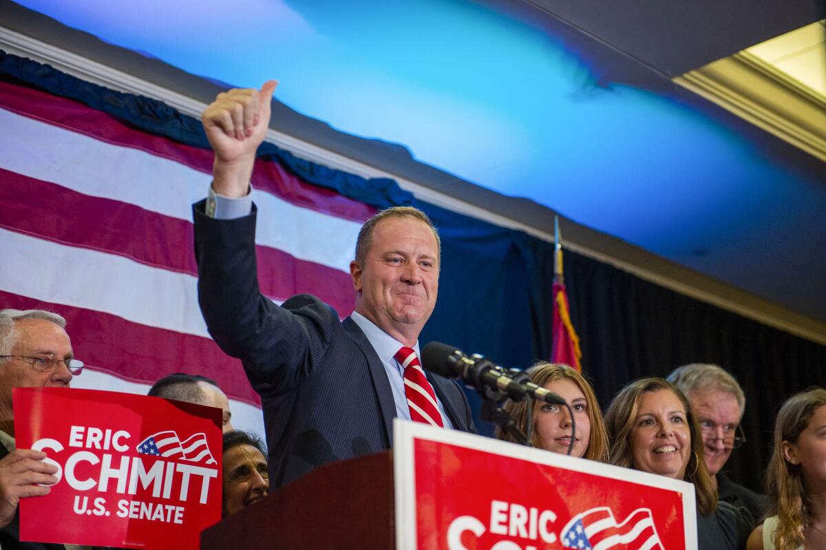FILE - Missouri Attorney General Eric Schmitt acknowledges the crowd of supporters at his election night watch party in St. Louis, Mo., Tuesday, Aug. 2, 2022, after winning the GOP primary for U.S. Senate. Schmitt be facing two opponents with deep pockets in November - Democrat and Anheuser-Busch beer heiress Trudy Busch Valentine, and independent John Wood. Wood is a Republican who has the financial backing of a PAC led by former Republican Sen. John Danforth. (Emily Curiel/The Kansas City Star via AP, File)