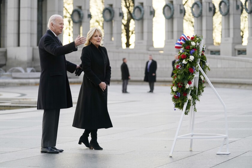 President Joe Biden and first lady Jill Biden mark the 80th anniversary of the Japanese attack on Pearl Harbor with a visit to the World War II Memorial, Tuesday, Dec. 7, 2021, in Washington. (AP Photo/Evan Vucci)