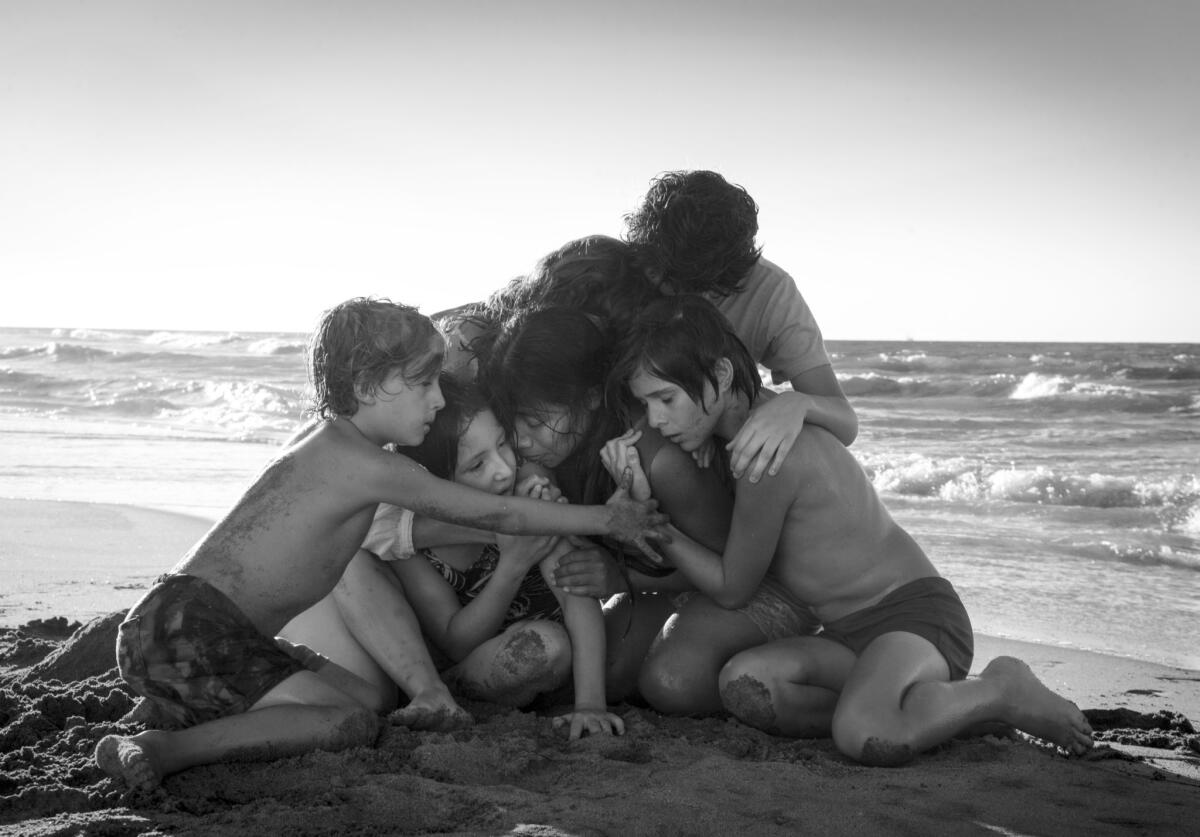 Yalitza Aparicio, center, in a scene from the film "Roma," by filmmaker Alfonso Cuaron.