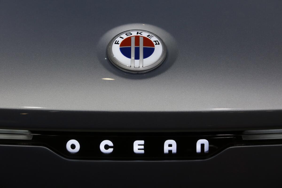 A badge on the hood of a Fisker Ocean electric sports utility vehicle.