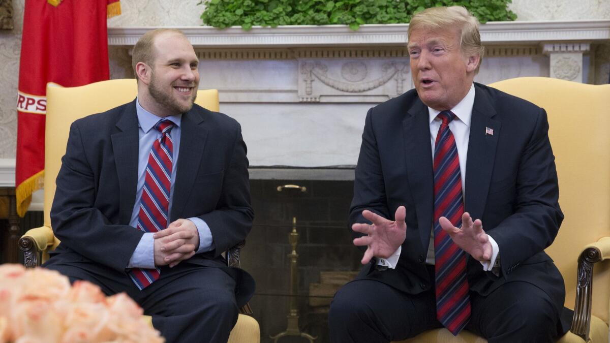 President Trump speaks during a meeting with Joshua Holt at The White House on Saturday. Holt was released that day after being imprisoned in Venezuela for two years.