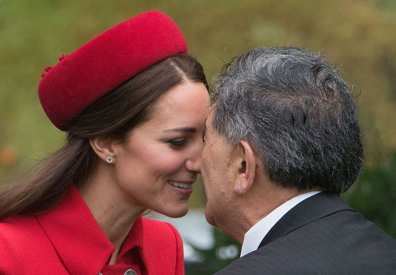 Catherine, the Duchess of Cambridge, receives a hongi, a traditional Maori greeting, by a Maori elder during a welcoming at Government House in Wellington, New Zealand's capital.