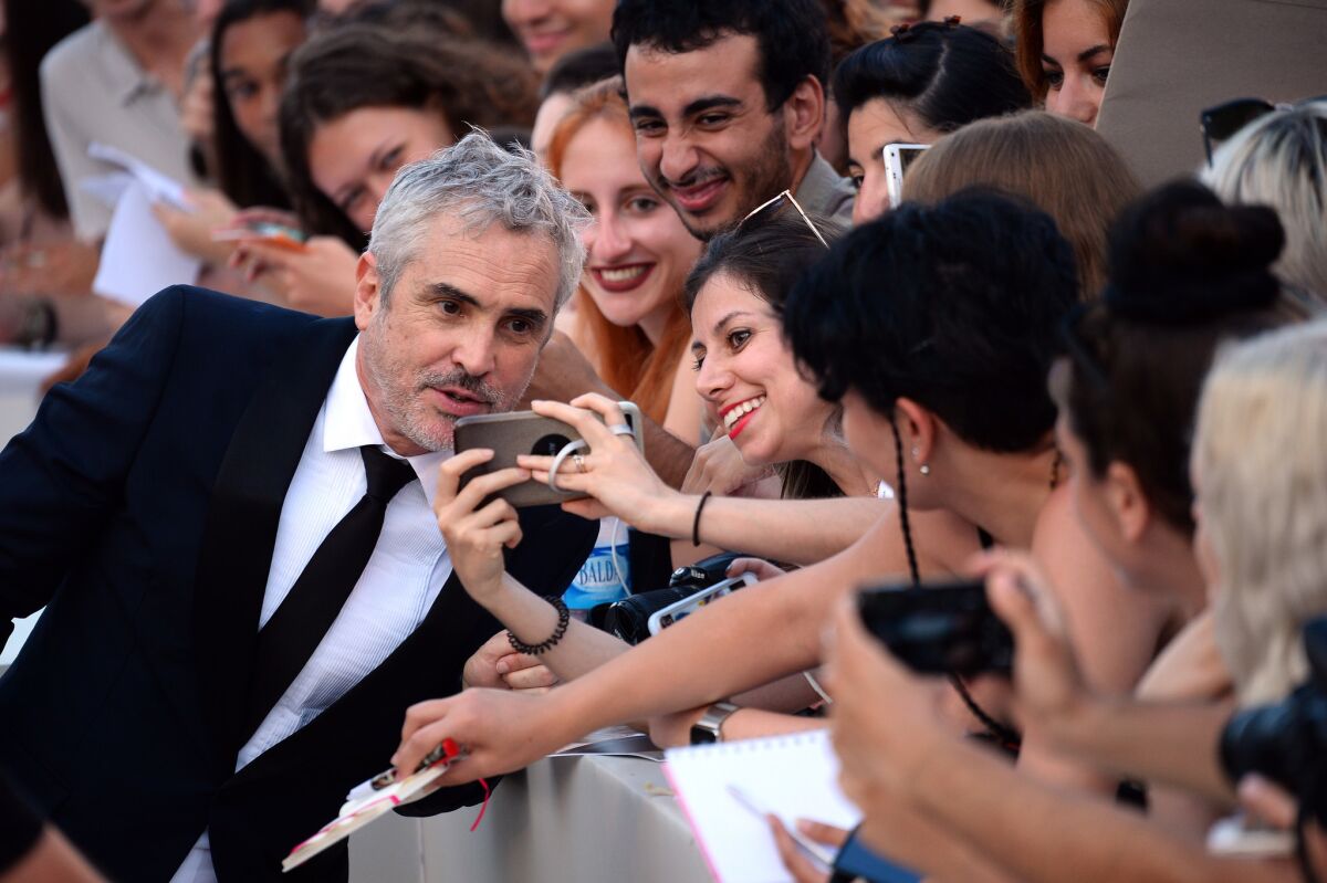 Alfonso Cuarón walks the red carpet ahead of the "Roma" screening during the 75th Venice Film Festival. "Roma" will premiere on Netflix.