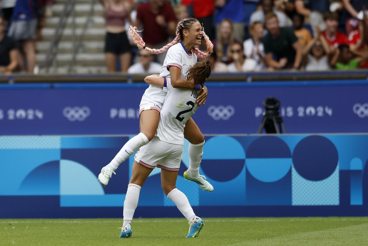 Trinity Rodman, top, celebrates with U.S. teammate Emily Fox after scoring in extra time in a 1-0 victory over Japan.