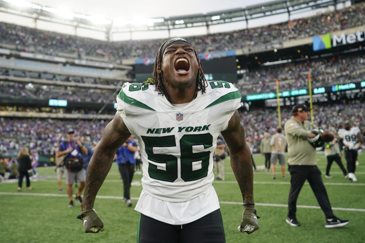 New York Jets linebacker Quincy Williams (56) celebrates after an NFL football game against the Buffalo Bills, Sunday, Nov. 6, 2022, in East Rutherford, N.J. (AP Photo/John Minchillo)