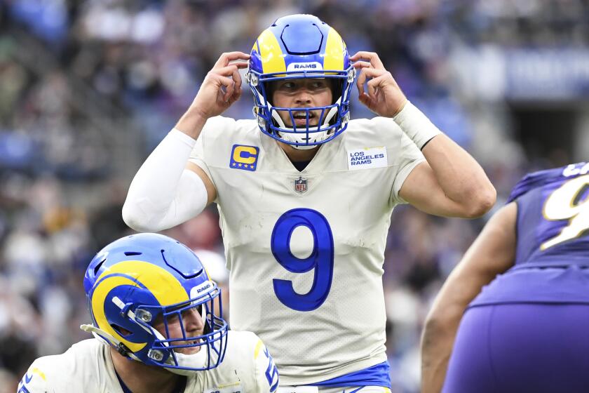 Los Angeles Rams quarterback Matthew Stafford (9) gestures while under center during the second half of an NFL football game against the Baltimore Ravens, Sunday, Jan. 2, 2022, in Baltimore. (AP Photo/Terrance Williams)